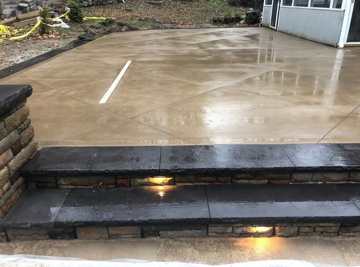 Smooth finished concrete patio with outdoor furniture