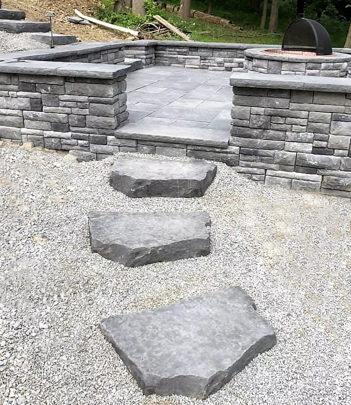 Newly poured concrete patio slab with wood form edges still in place
