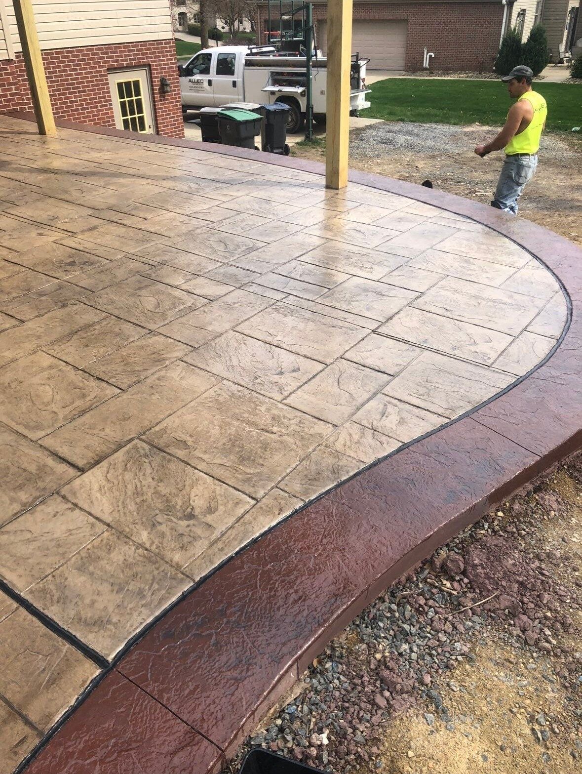 Smooth finished concrete patio slab off the back of a home