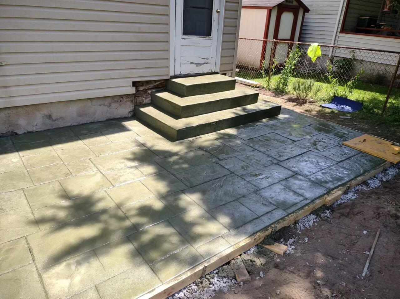 Stamped concrete patio with decorative pattern and integral color