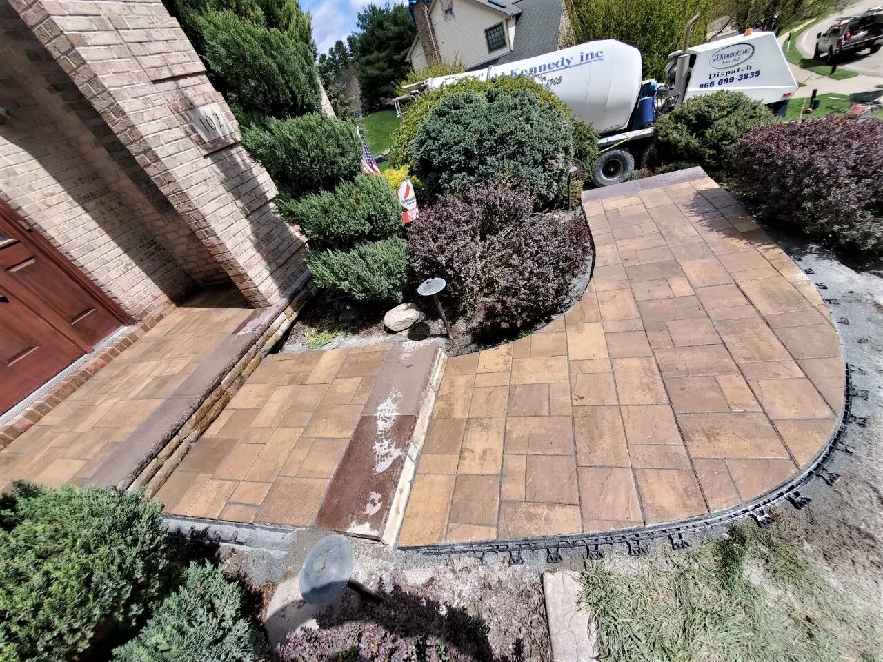 Decorative stamped concrete with custom pattern and color accent