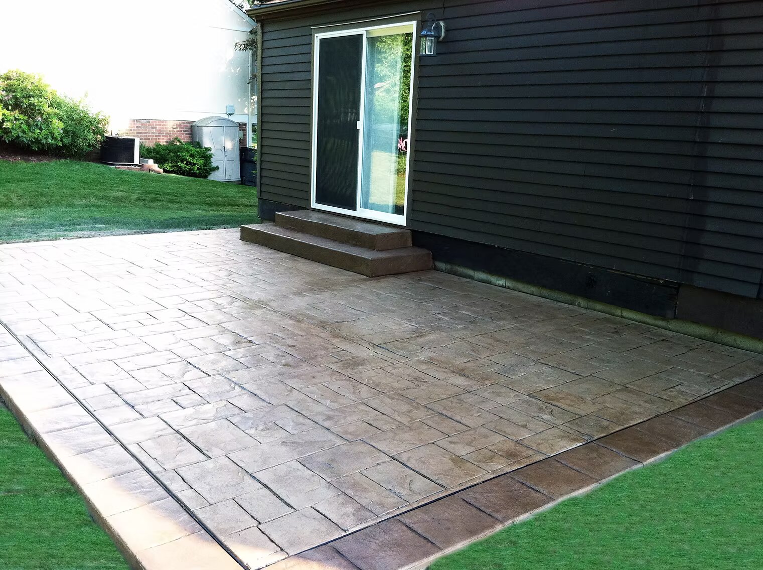 Stamped concrete flatwork with pattern detail and border treatment